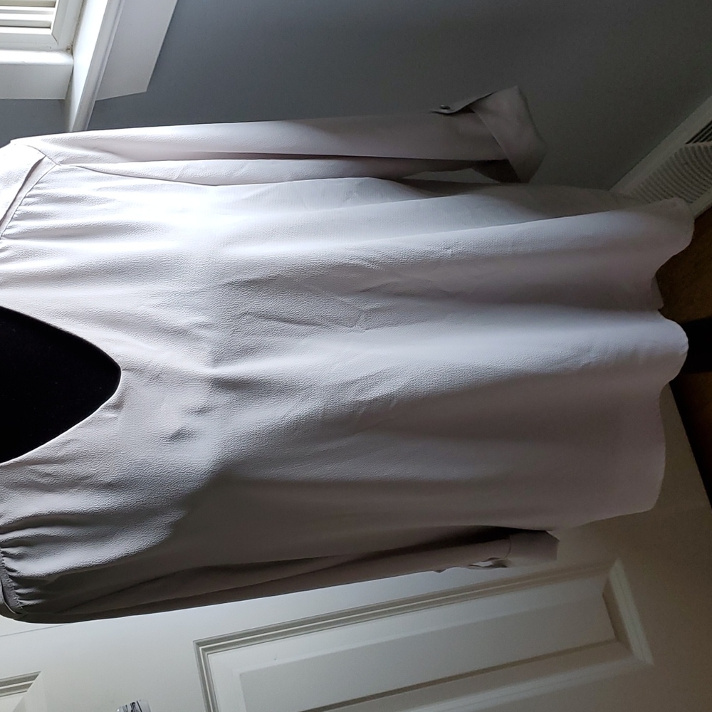 Women's pull-on 3/4 sleeves blouse.  Hi-lo hem in soft grey.